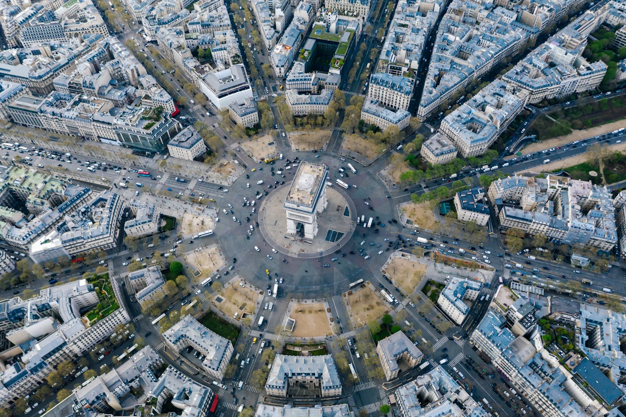 Breathtaking aerial image of Arc de Triomphe nestled within Pariss vibrant cityscape.